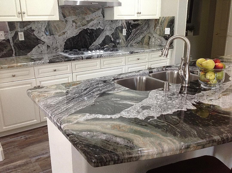 Granite countertops with granite backsplashes. Custom kitchen countertops.